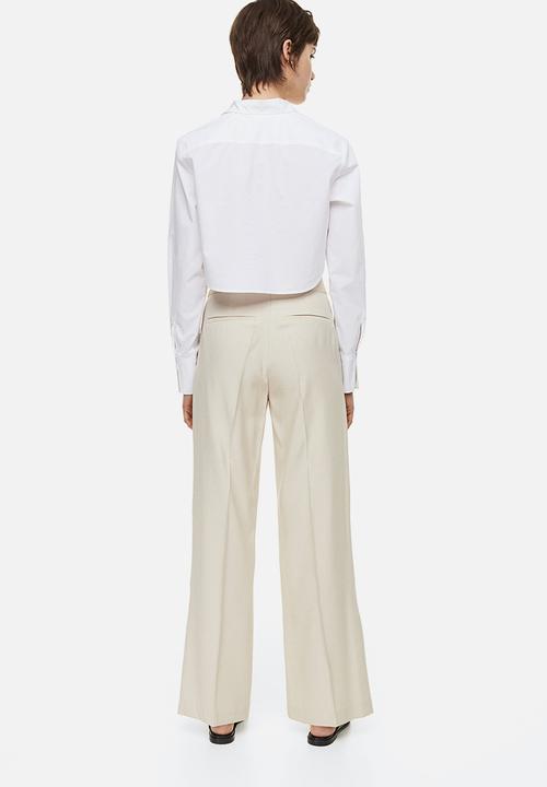 H&M - Slit-hem trousers - light beige 