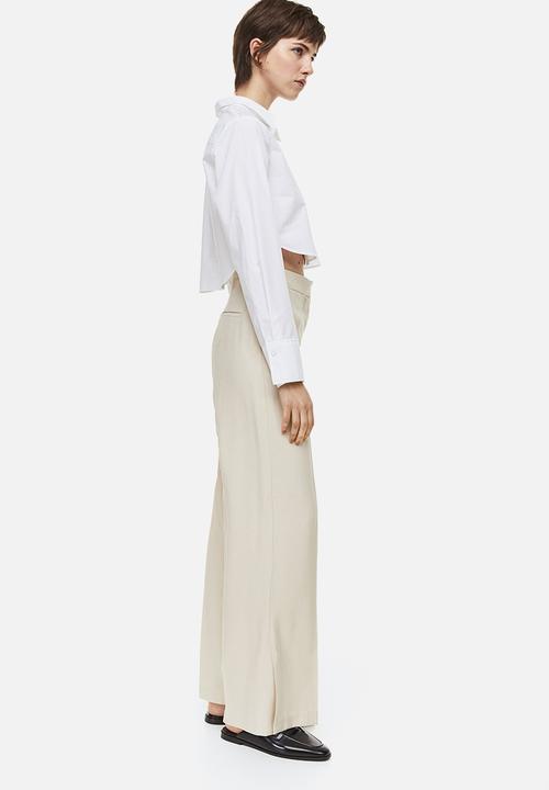 H&M - Slit-hem trousers - light beige 