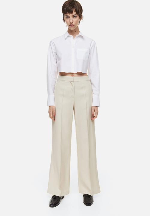 H&M - Slit-hem trousers - light beige 