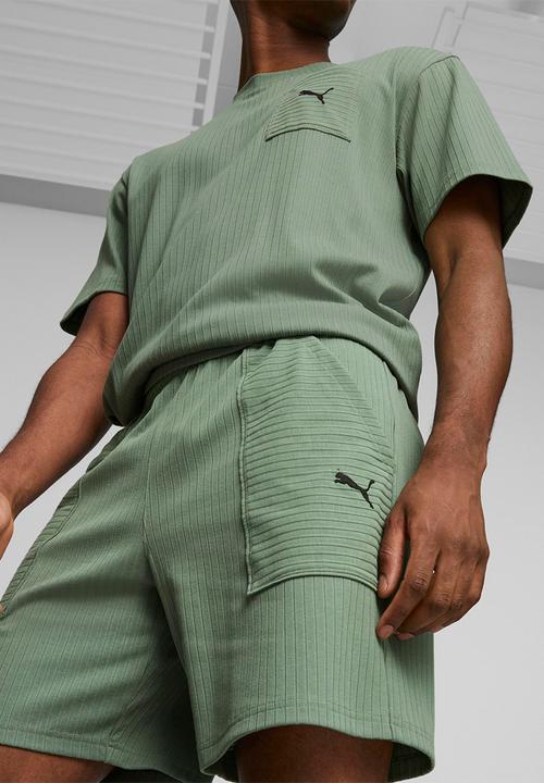 PUMA - M studio unwind 7" knit short - green 