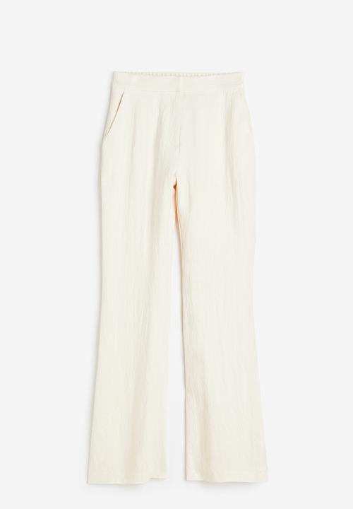 H&M - Flared viscose trousers - cream 