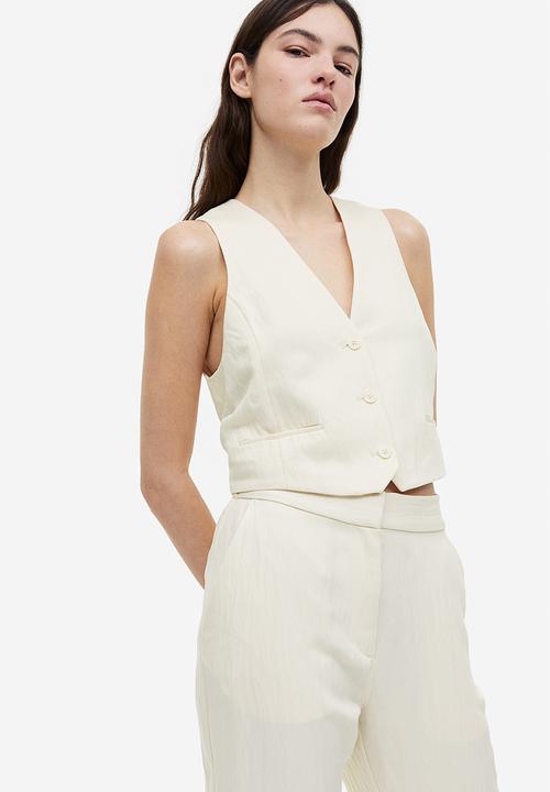 H&M - Flared viscose trousers - cream 