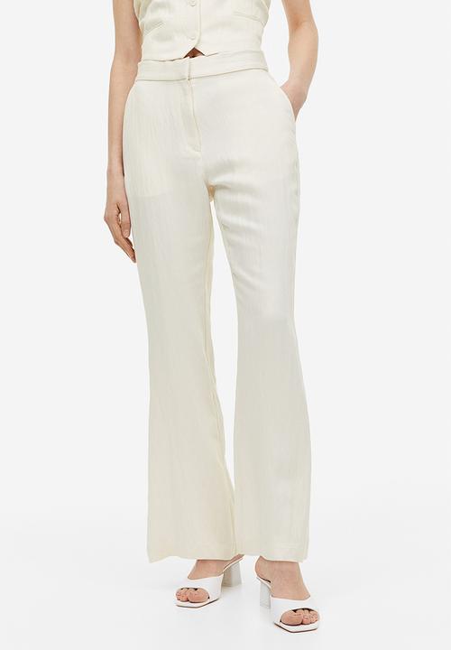 H&M - Flared viscose trousers - cream 