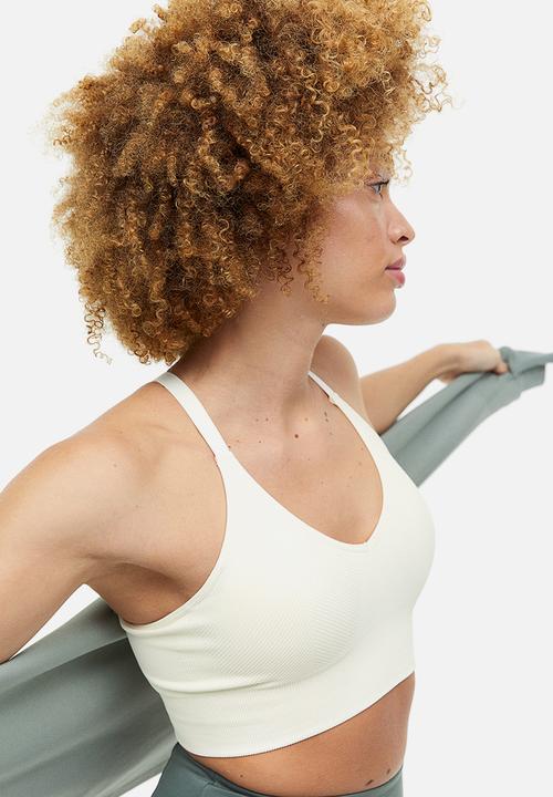 H&M - Drymove™ medium support sports bra - cream 