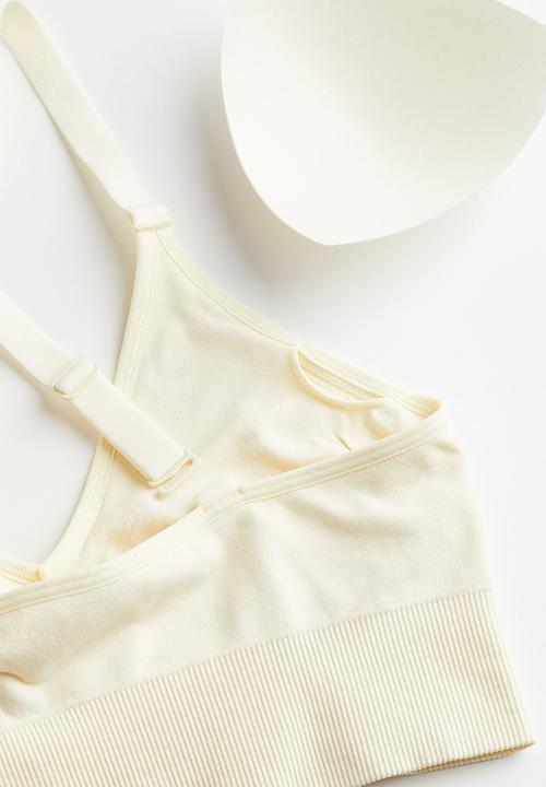 H&M - Drymove™ medium support sports bra - cream 