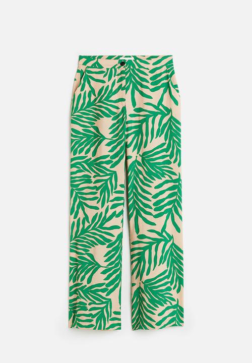 H&M - Flared trousers - light beige leaf-patterned 