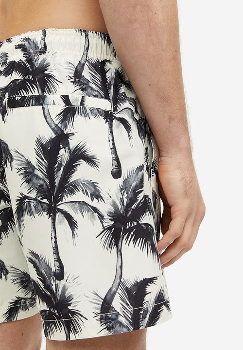 H&M - Patterned swim shorts - white palm trees