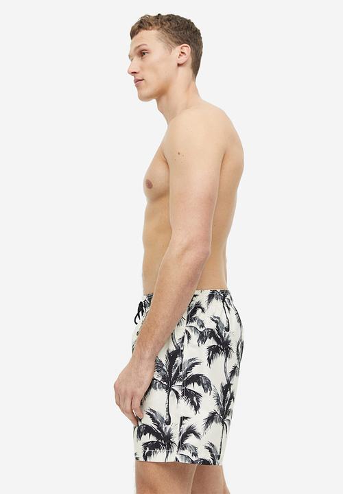 H&M - Patterned swim shorts - white palm trees