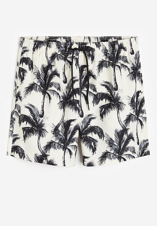 H&M - Patterned swim shorts - white palm trees