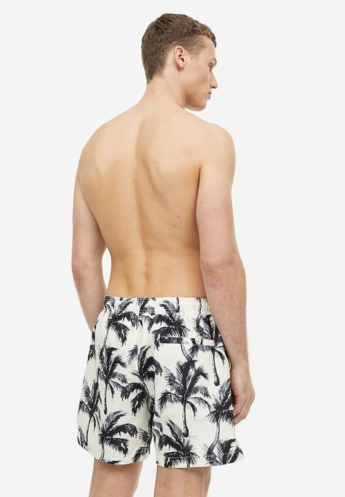 H&M - Patterned swim shorts - white palm trees