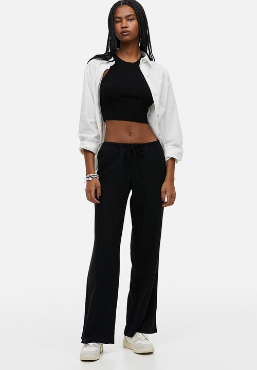 H&M - Wide trousers - black
