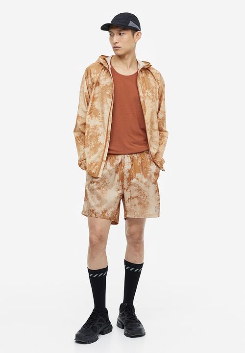 H&M - Fast-drying sports shorts - beige patterned