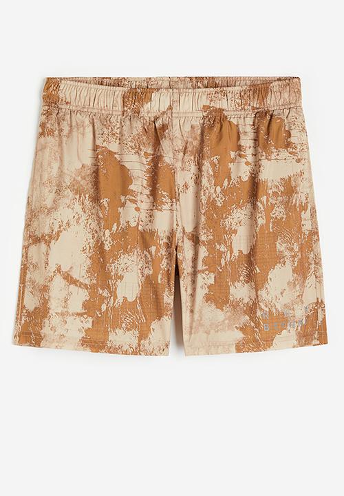 H&M - Fast-drying sports shorts - beige patterned