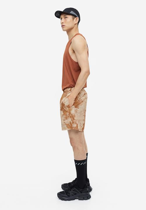 H&M - Fast-drying sports shorts - beige patterned