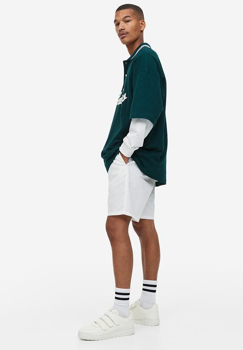 H&M - Oversized fit polo shirt - dark green rad grades 
