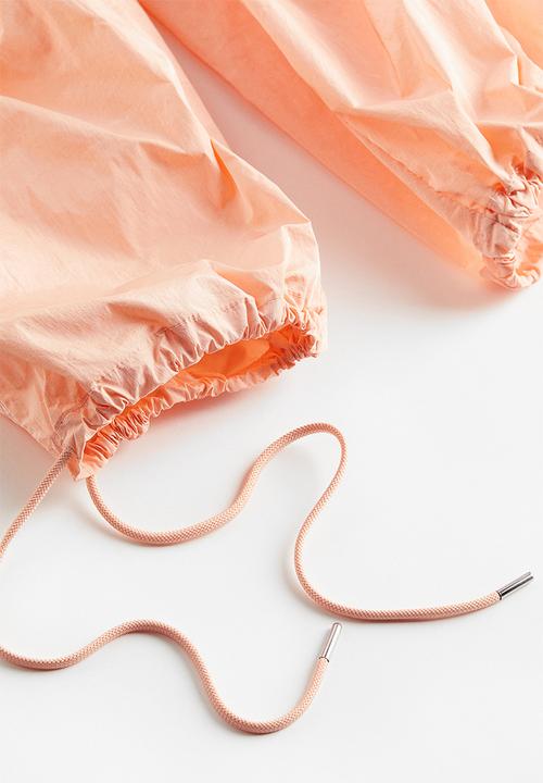 H&M - Nylon parachute trousers - apricot