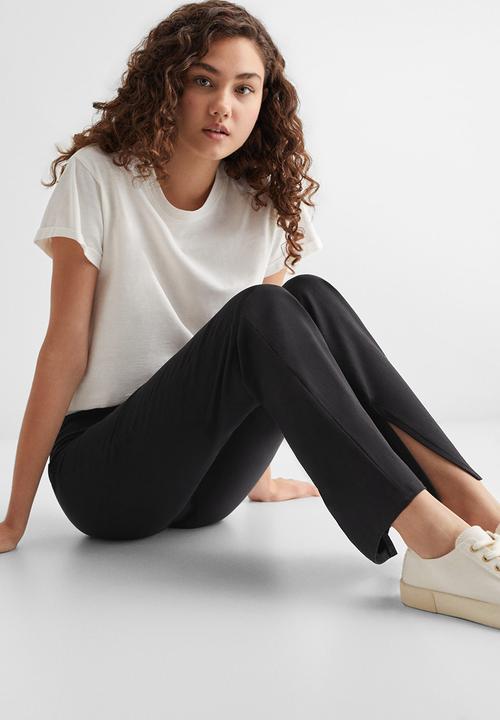 MANGO - Leggings flaret - black