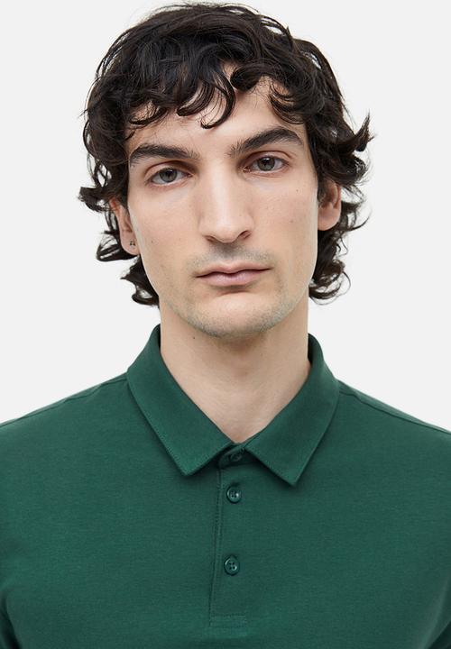 H&M - Slim fit polo shirt - dark green 