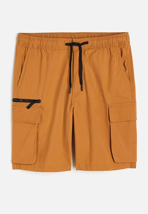 H&M - Regular fit knee-length cargo shorts - rust orange 