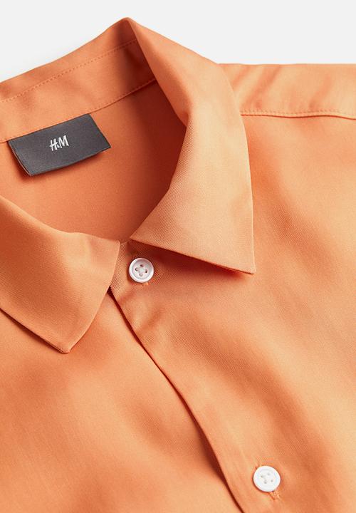 H&M - Regular fit short-sleeved lyocell shirt - apricot