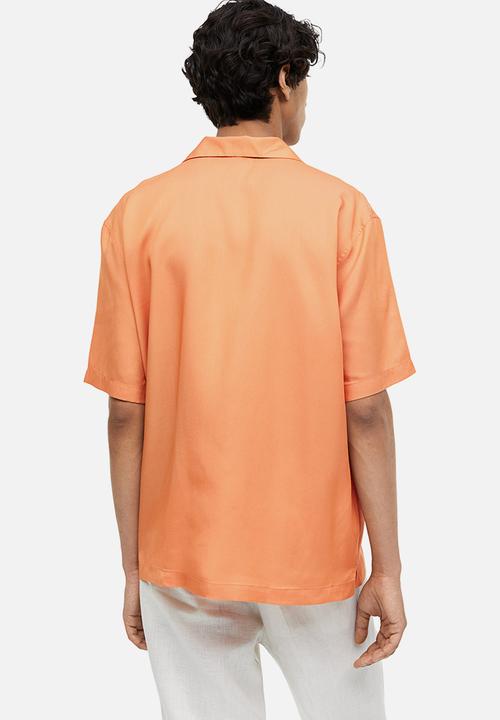 H&M - Regular fit short-sleeved lyocell shirt - apricot