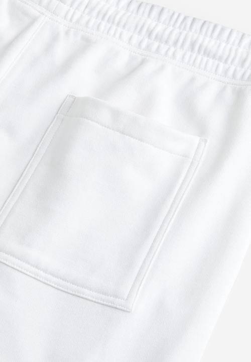 H&M - Relaxed fit printed sweat shorts - white story 
