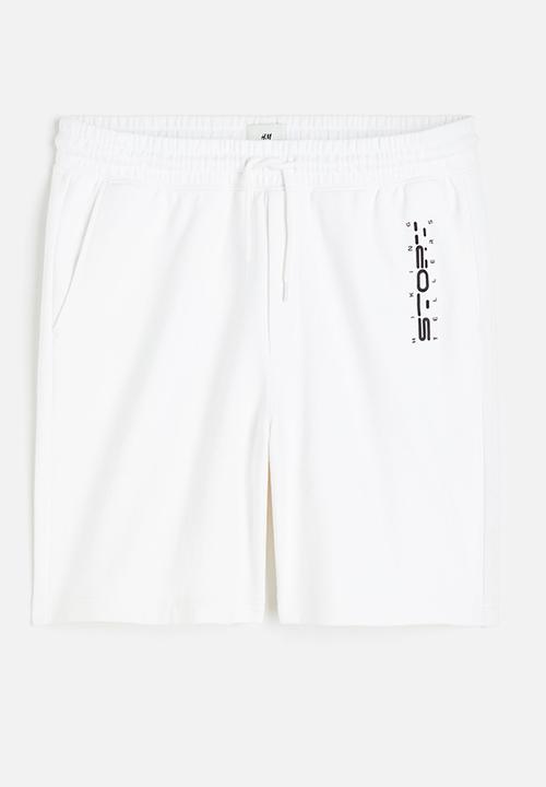 H&M - Relaxed fit printed sweat shorts - white story 