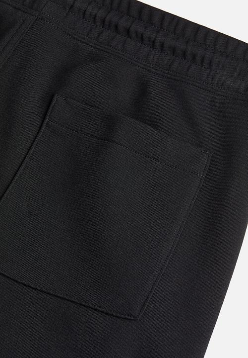 H&M - Regular fit printed sweat shorts - black nirvana