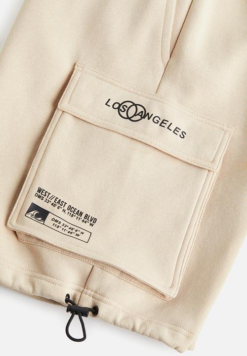 H&M - Relaxed fit printed cargo sweat shorts - beige los angeles