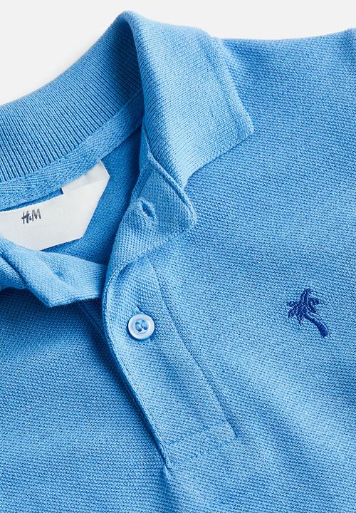 H&M - Cotton piqué polo shirt - light blue 