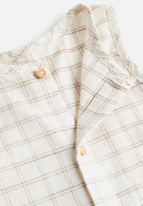 H&M - Sleeveless romper suit - beige 
