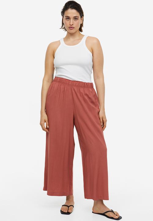 H&M - Cropped pull-on trousers - brick red 