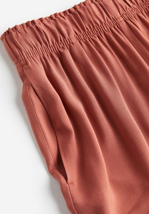 H&M - Cropped pull-on trousers - brick red 
