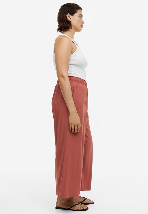 H&M - Cropped pull-on trousers - brick red 