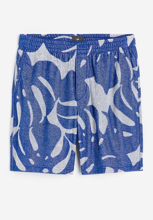 H&M - Regular fit terry shorts - blue leaf-patterned 