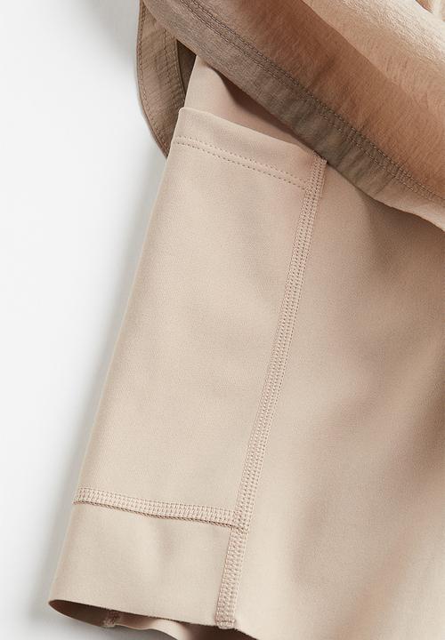 H&M - Drymove™ double-layered running shorts - beige