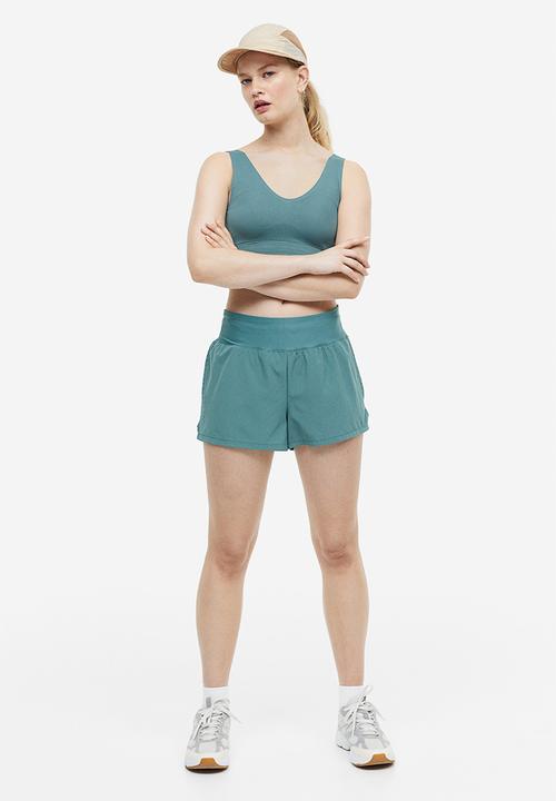 H&M - Drymove™ double-layered sports shorts - teal