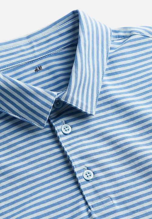 H&M - Slim fit polo shirt - blue/light blue striped