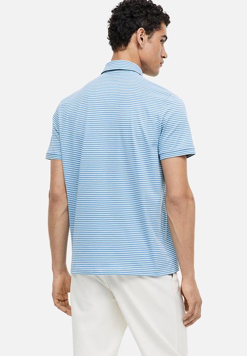 H&M - Slim fit polo shirt - blue/light blue striped