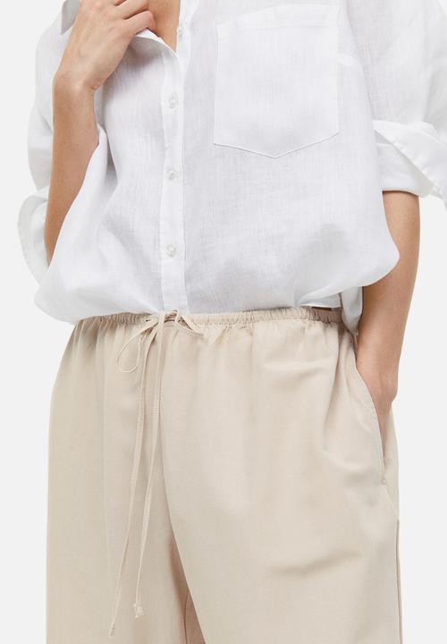 H&M - Linen-blend trousers - light beige 