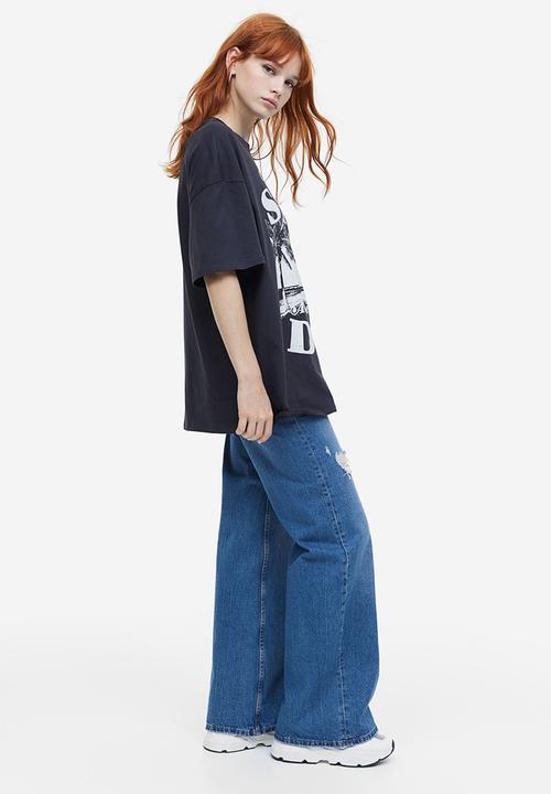 H&M - Oversized printed T-shirt - black cherish the sun