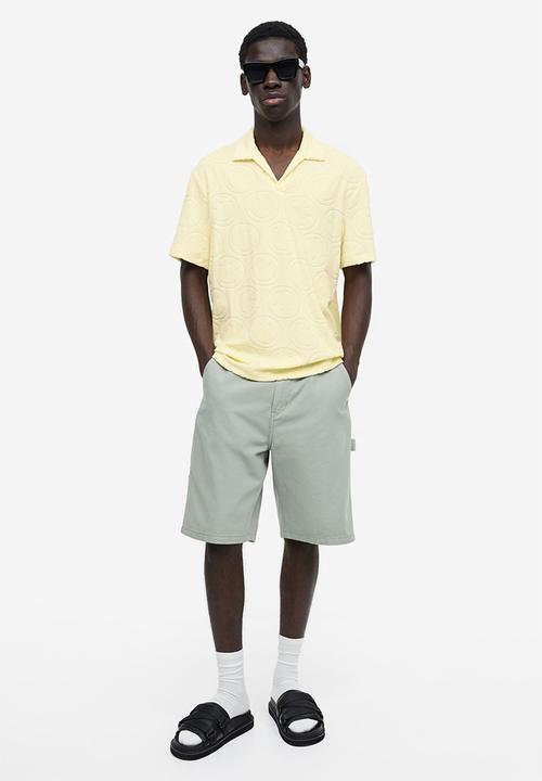 H&M - Regular fit terry polo shirt - yellow & smiley®