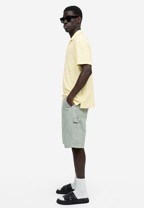 H&M - Regular fit terry polo shirt - yellow & smiley®