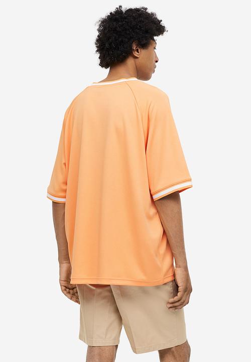 H&M - Oversized fit printed mesh t-shirt - pale orange togetherness