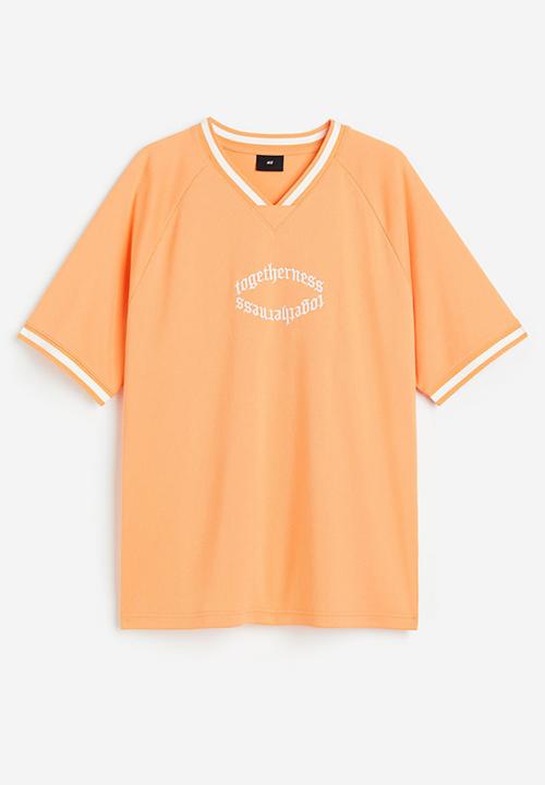 H&M - Oversized fit printed mesh t-shirt - pale orange togetherness