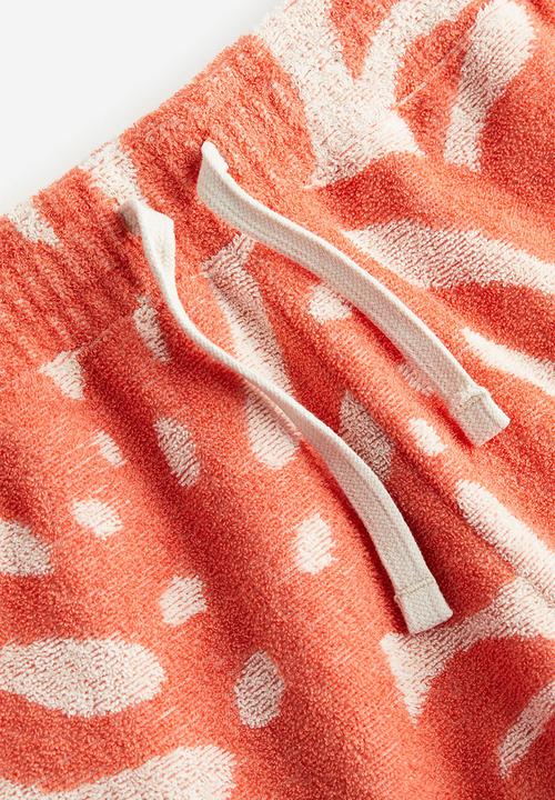 H&M - Patterned terry pull-on shorts - orange leaves