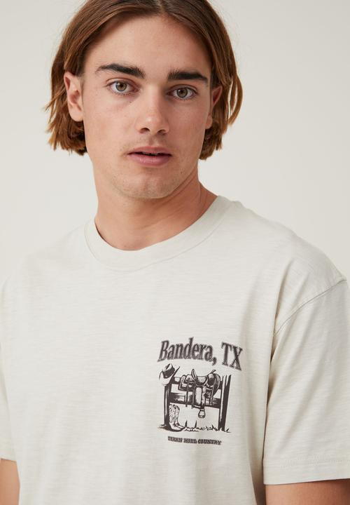 Cotton On - Loose fit graphic T-shirt - ivory/bandera texas
