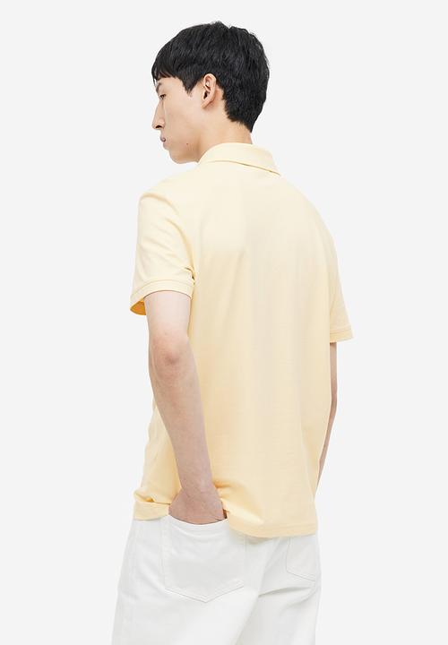 H&M - Coolmax® slim fit polo shirt - light yellow