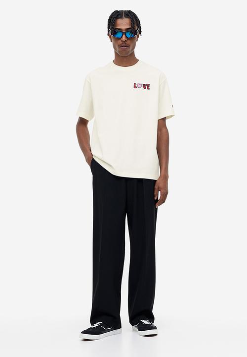 H&M - Relaxed fit t-shirt - cream/keith haring