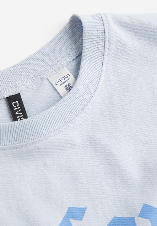H&M - Oversized printed T-shirt - light blue/oxford university